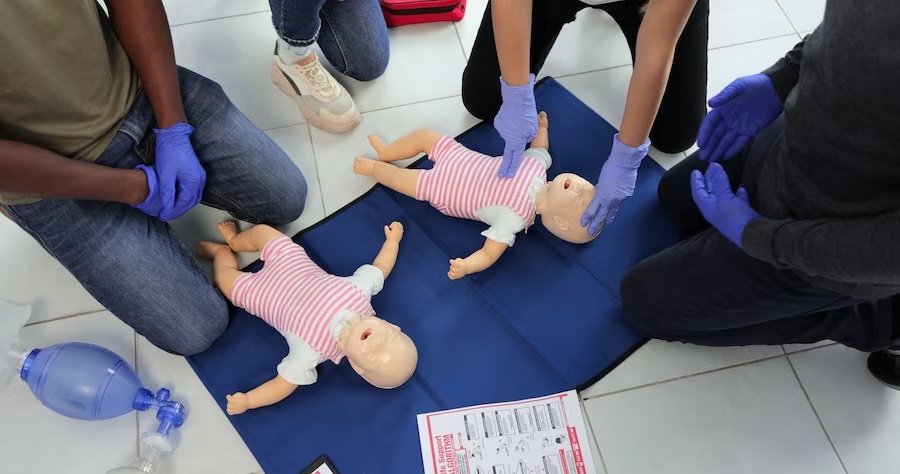 Practising CPR on Infant Dolls